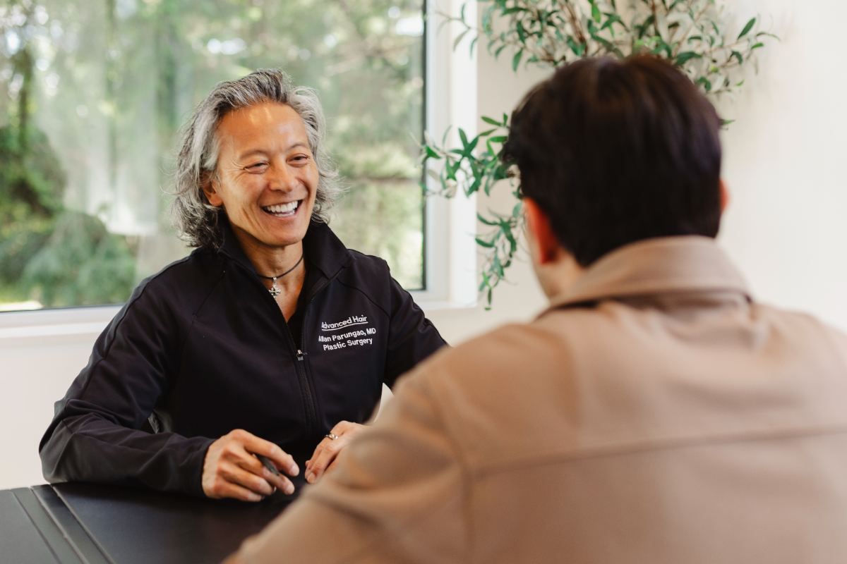 An Advanced Hair Restoration physician consulting with a patient