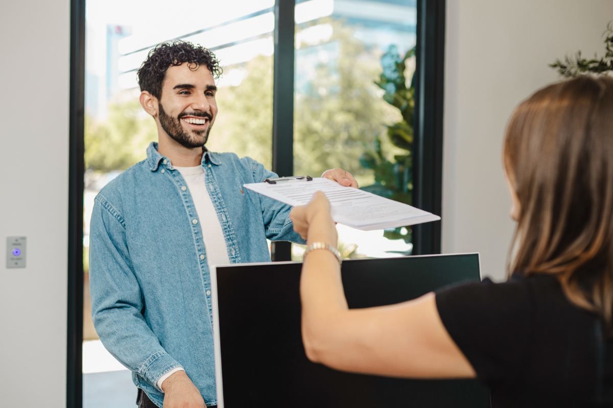A patient at the Advanced Hair Restoration front desk