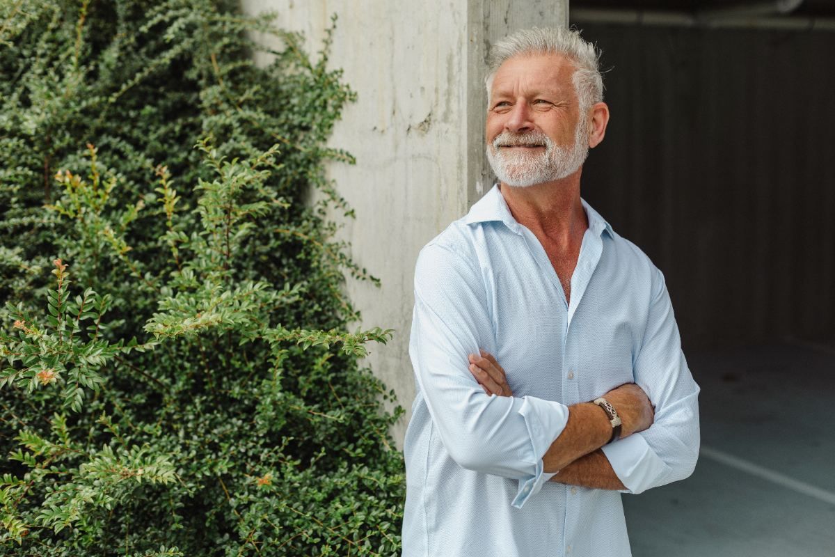 A man standing outdoors in the sun