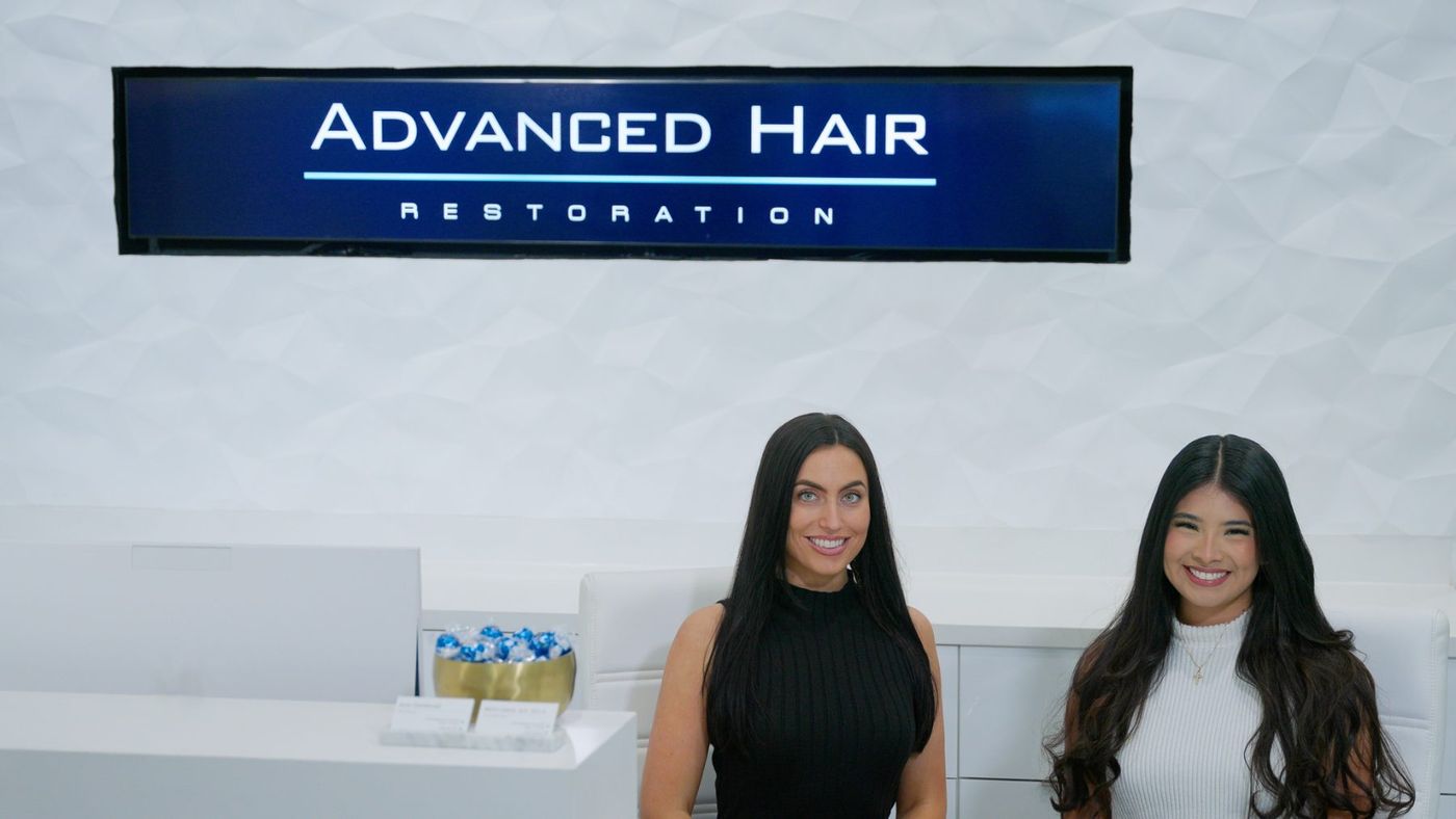 Two Advanced Hair team members at the Dallas front desk